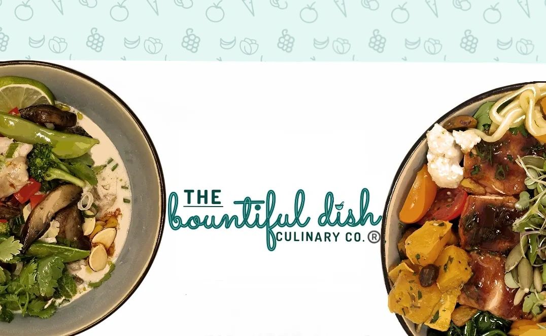 Two bowls full of fresh food with The Bountiful Dish Culinary Co. logo centered between them