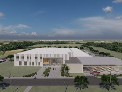 Rendering of a new school building with greenery and blue sky