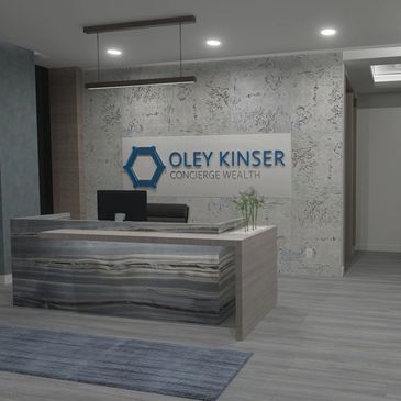 Modern office reception area with Oley Kinser sign.
