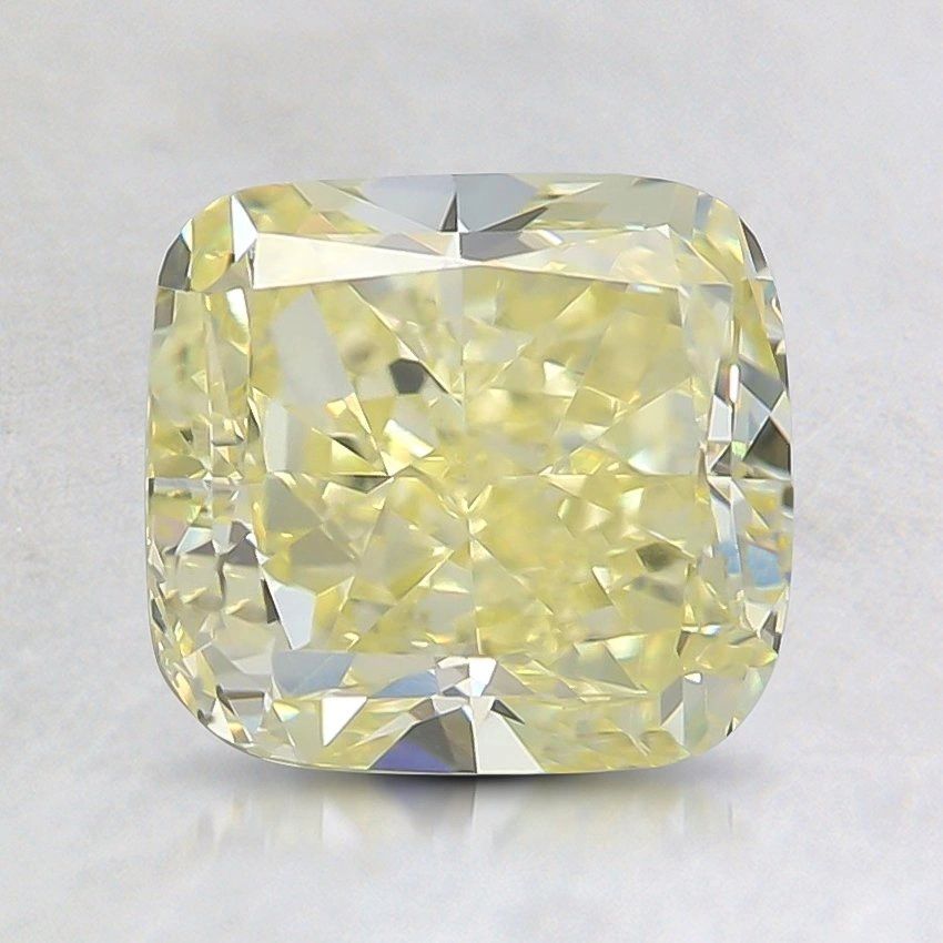 Close-up of a yellow cushion-cut diamond.