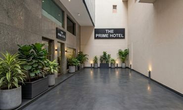 Entrance of The Prime Hotel with plants.