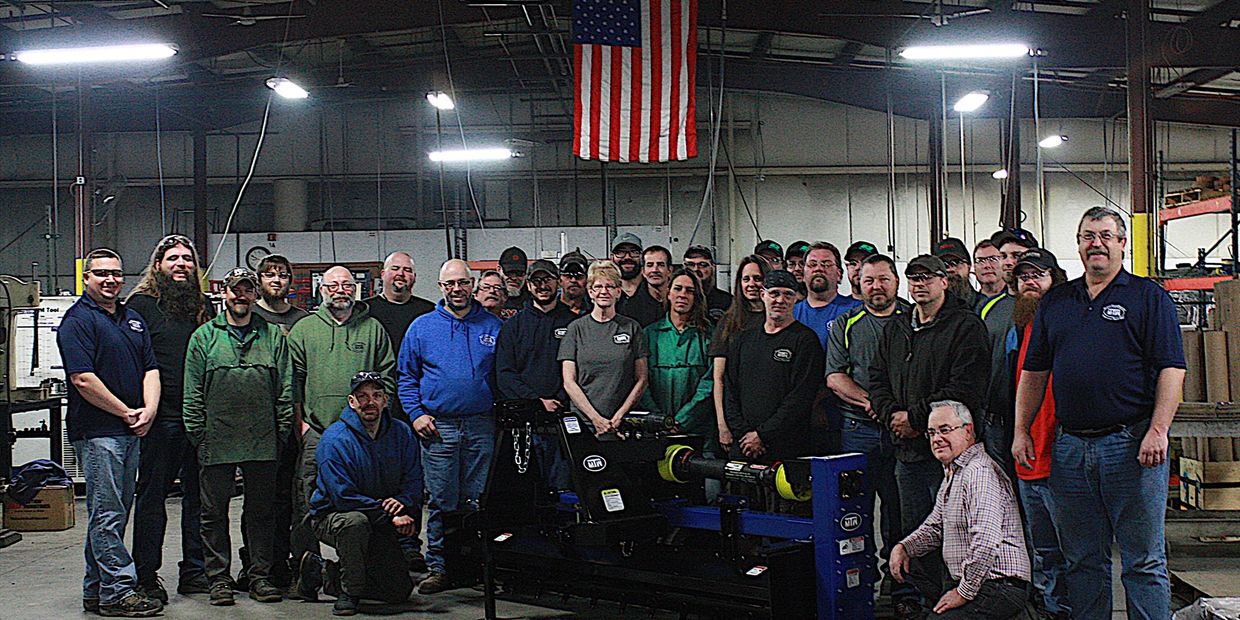 MTW MFG Employees Proudly Displaying The MTW Rotary Tool System 