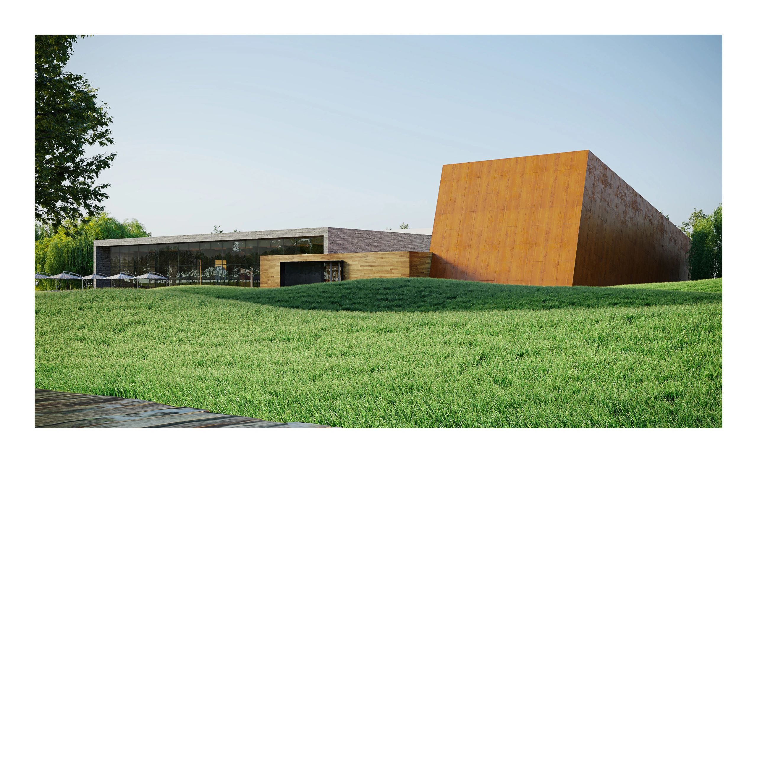 Modern building with mixed materials on a grassy hill under clear sky.