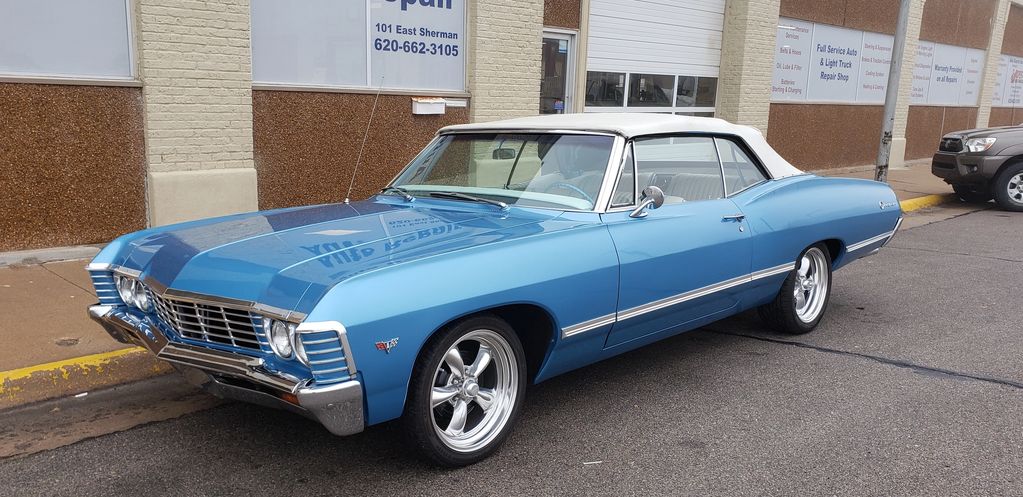 1967 Blue Chevrolet Impala 
2 Door White Top Convertible
V8 327 cubic inch
Built in Janesville WI