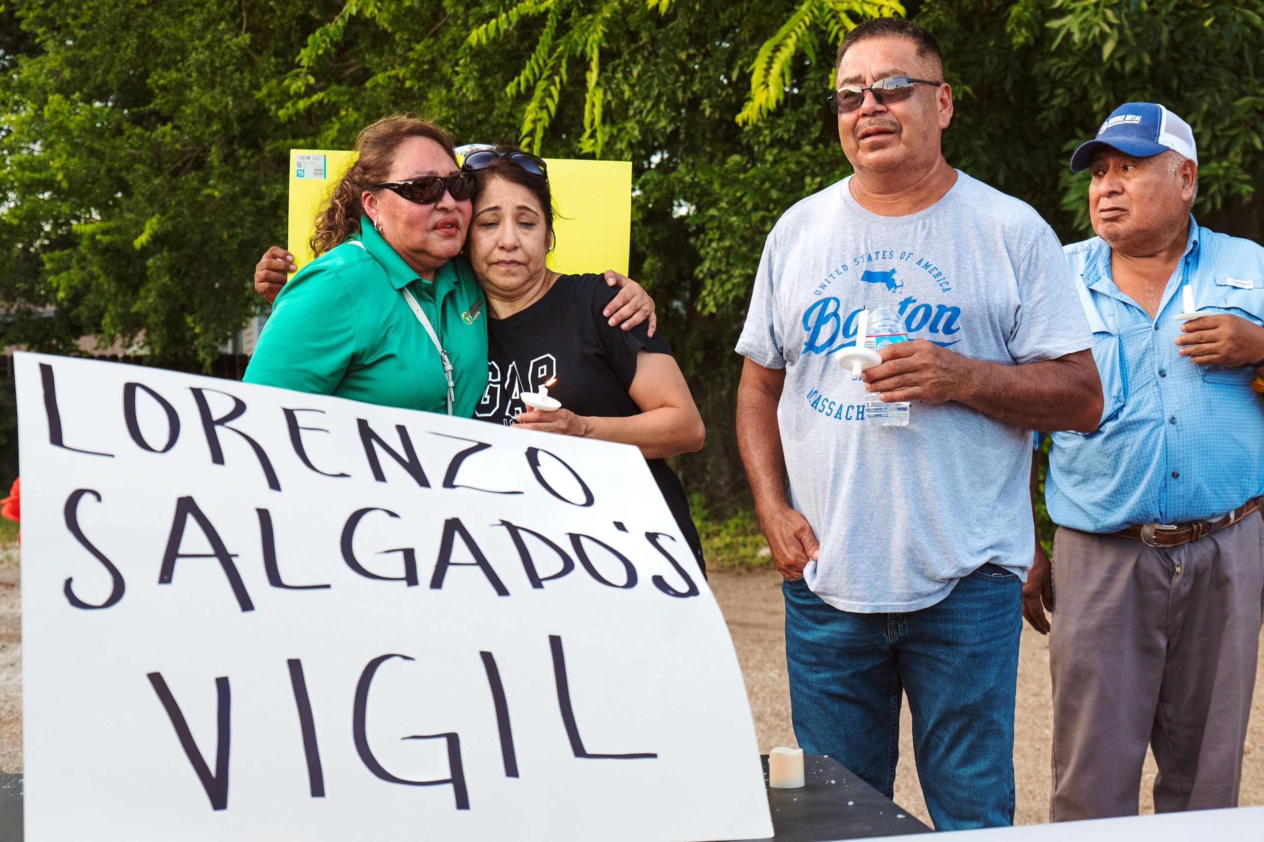 People holding a vigil with a sign for Lorenzo Salgado.