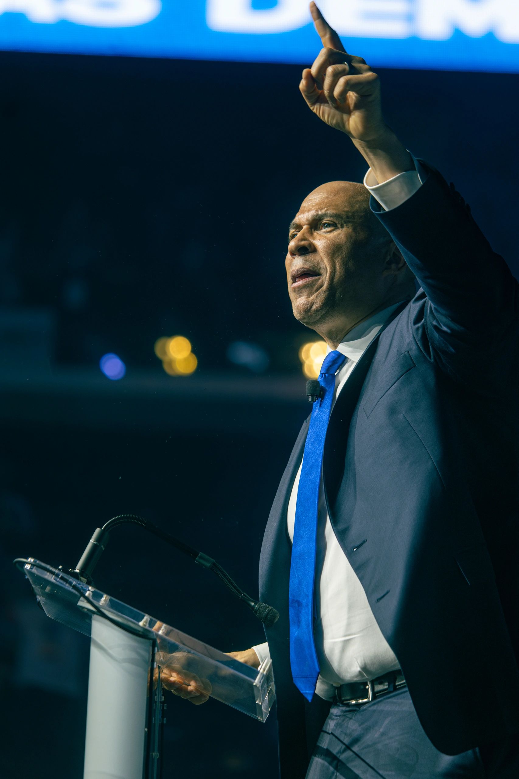 Man passionately speaking at a podium.