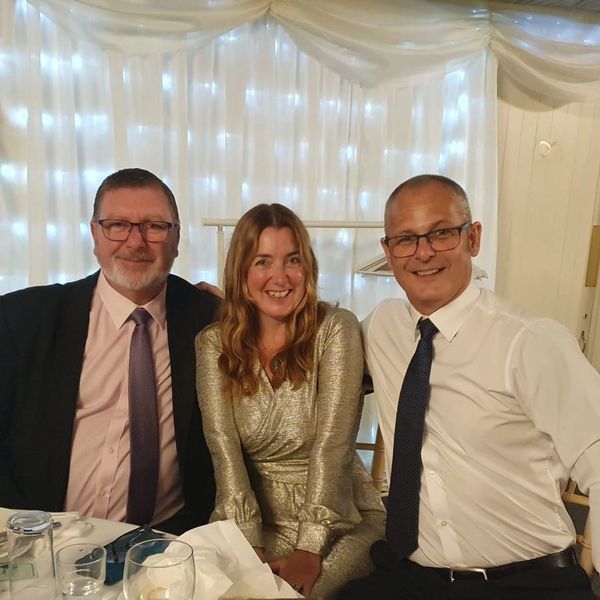 GAFHA founders Terry Fallows, Jo Gausden, and Dan Gausden. People dressed for a Rotary club dinner