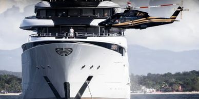 A helicopter landing on a private super yacht.