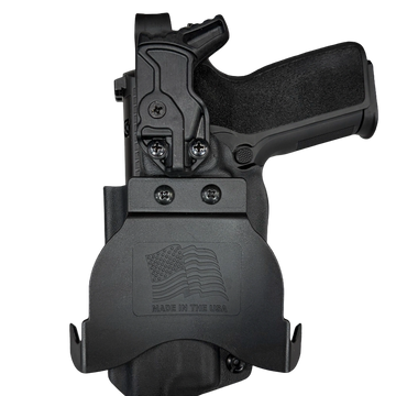 A black handgun in a holster with an American flag emblem.