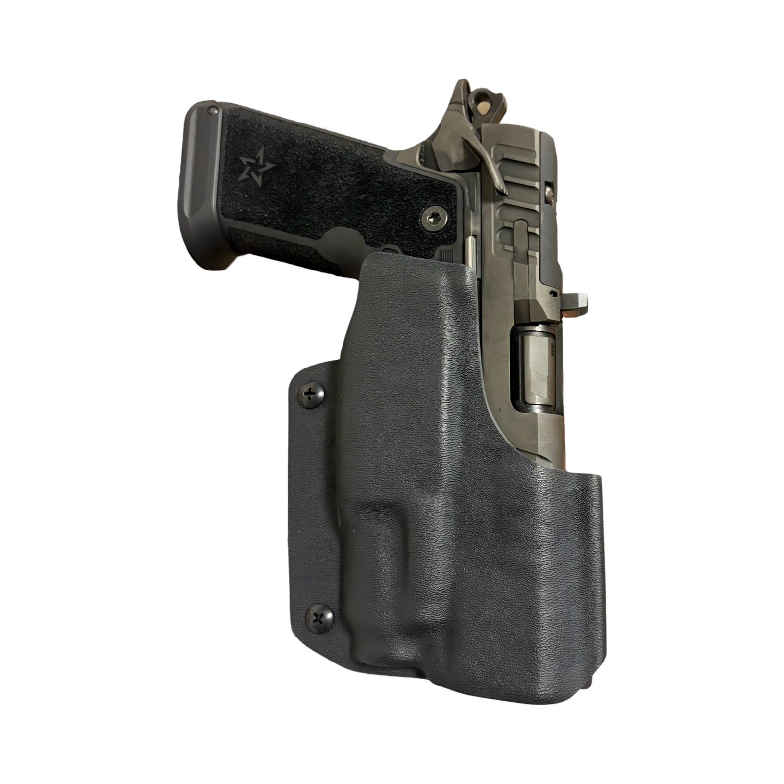 A handgun partially inside a black holster, isolated on black background.