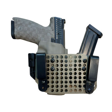 Compact firearm with magazine in a tactical holster.