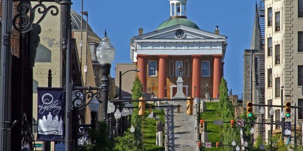 Historic courthouse with a statue and stairs in Lynchburg, Virginia.