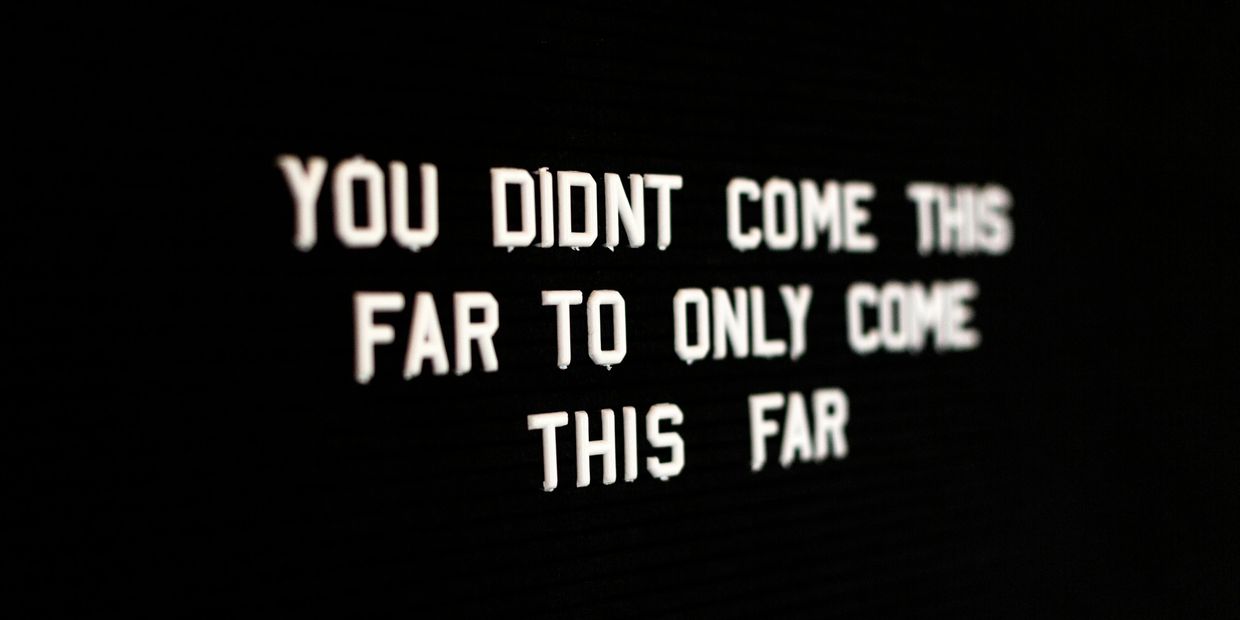 Motivational message in white text on black background.