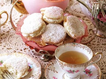 Cup of tea with sweet biscuits