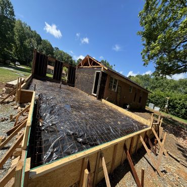 House extension under construction with foundation work.