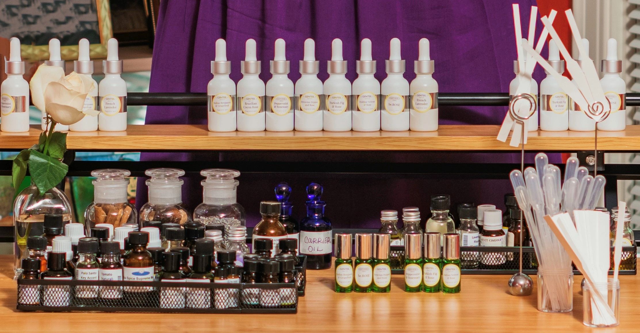 Close up photo of Terees Western's perfumer's organ. White lab bottles on top shelf. Apothecary bott