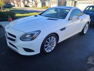 White sports car parked on driveway.