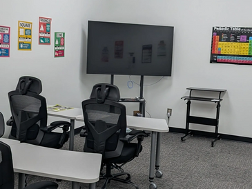 Well equipped classroom with individual wheeled tables and chairs