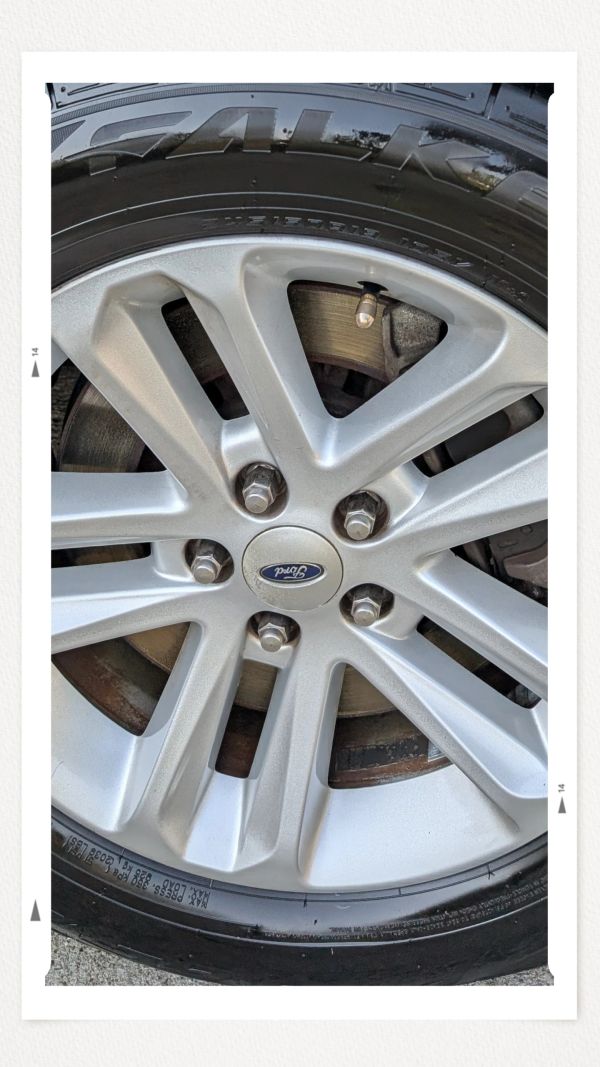 Close-up of a Ford car wheel and tire.