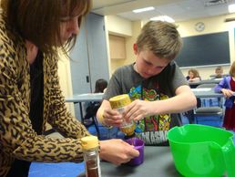 Kid PHIT youth learn about nutrition while creating healthy snacks.