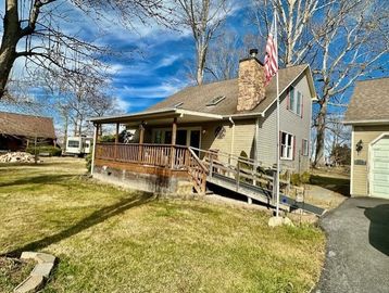 Charming salt box home sits on approx. 0.86 acres with 2 open lots. Boasting 2 oversized detached ga