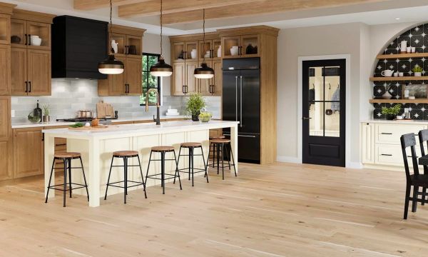 Spacious modern kitchen with wooden cabinets and island.