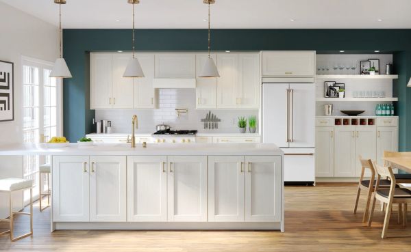 Bright, modern kitchen with white cabinetry and teal accent wall.