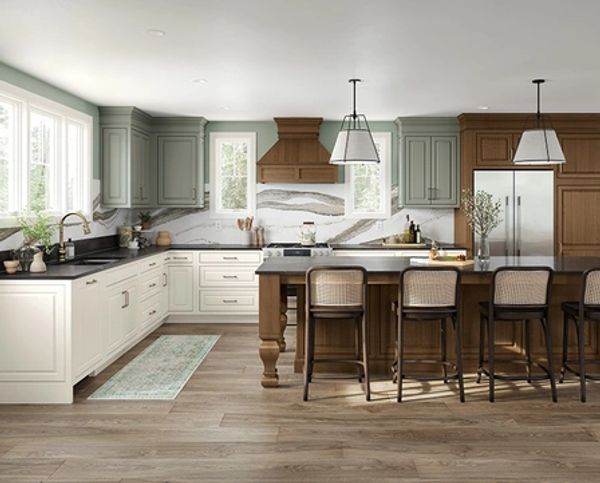 Modern kitchen with wood and green cabinets and island seating.