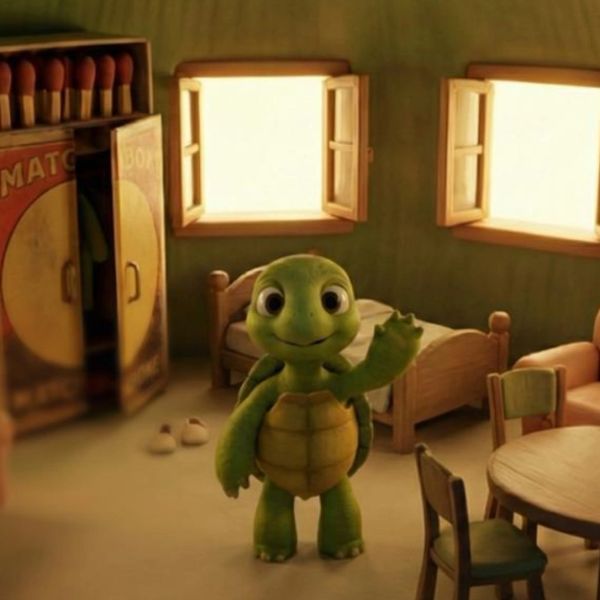 A cute animated turtle waving in a cozy room with wooden furniture.