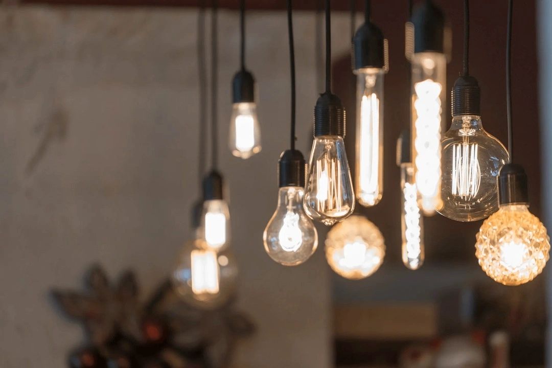 Cozy interior lighting created by using numerous hanging pendants lights.