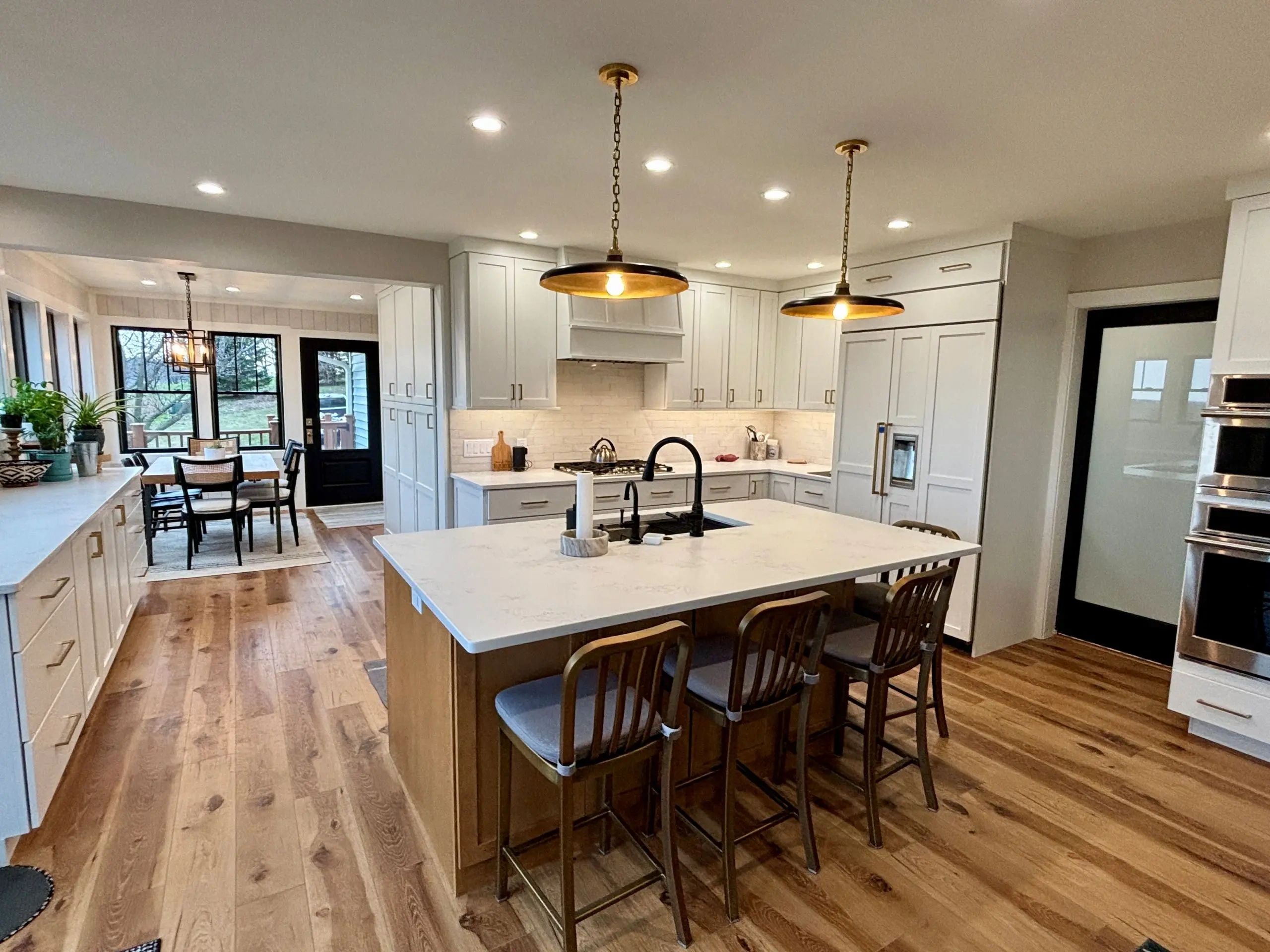 Modern kitchen with pendants and recessed lighting installation in Jefferson County WI