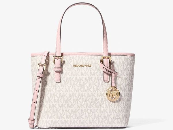 Michael Kors beige and pink tote bag with logo charm and adjustable strap.