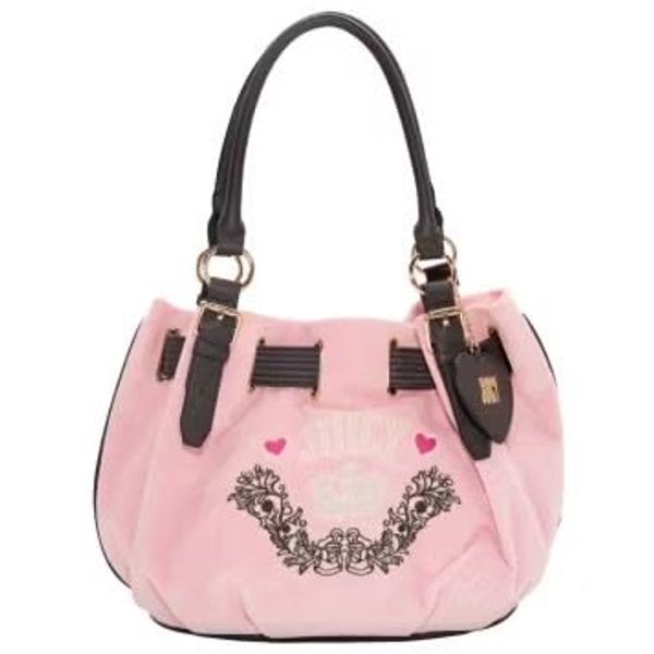 Pink handbag with black handles and floral design.
