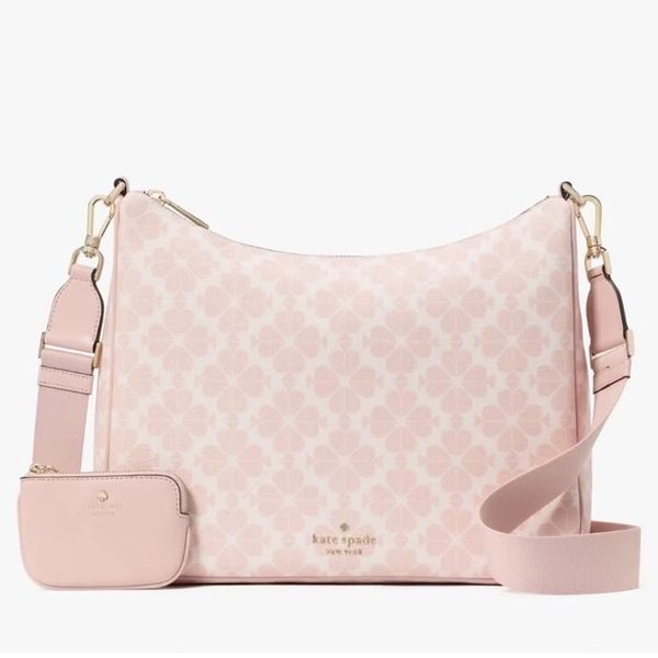 Light pink Kate Spade handbag with floral pattern and detachable strap pouch.