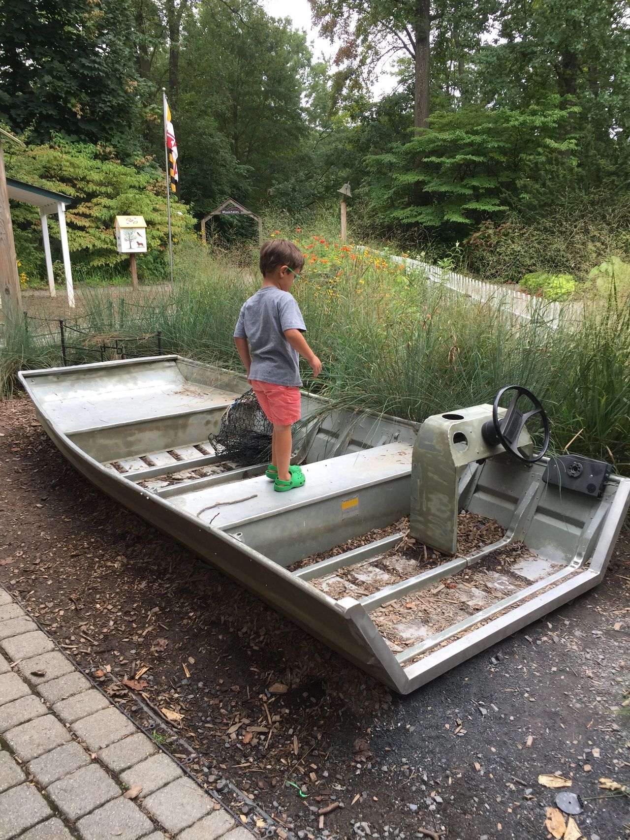 Little boy on grounded boat