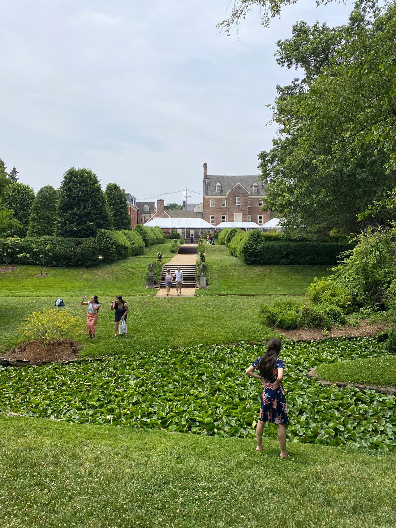 Garden with people near historic buildings