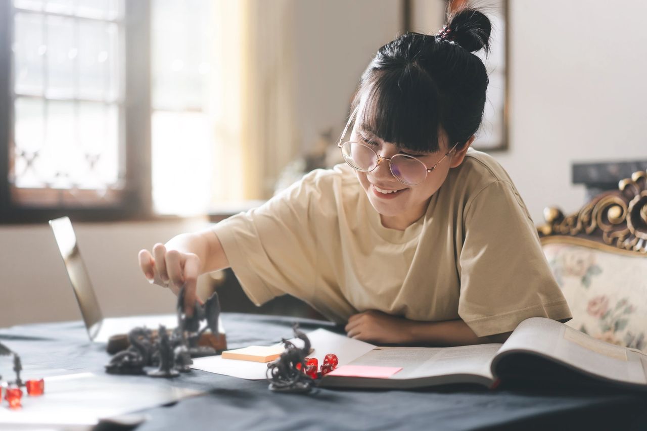 Girl playing D&D