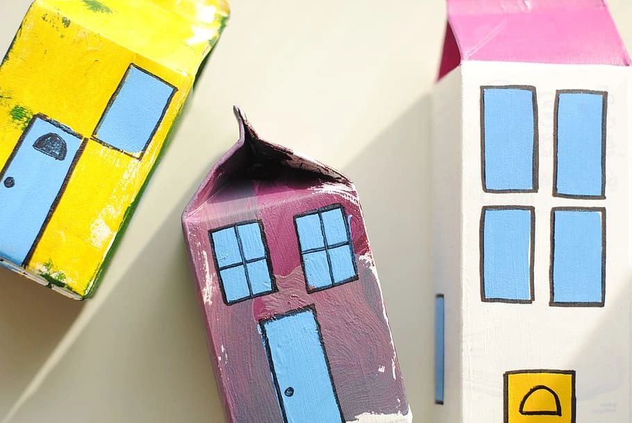 Beverage cartons painted to look like houses