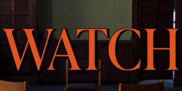 Large orange text 'WATCH' displayed indoors.