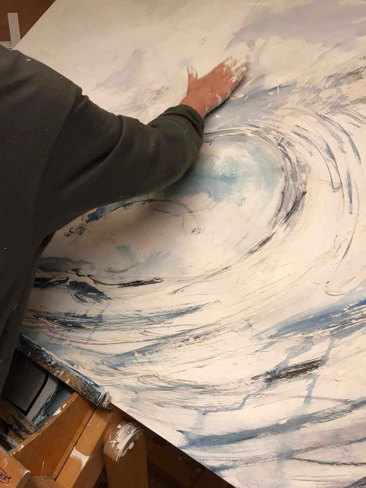 A painter painting with their hand