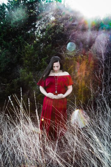 mom in red maternity gown, in the sun