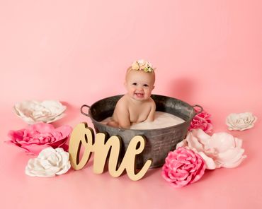 milk bath session with pink and white flowers