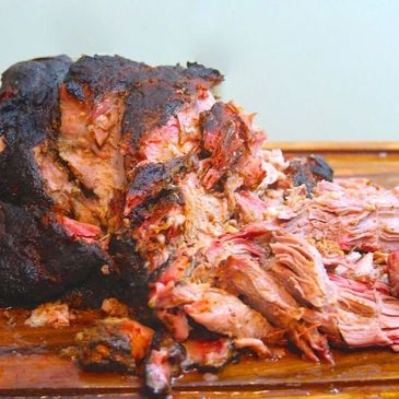 Pulled Pork on a cutting Board.