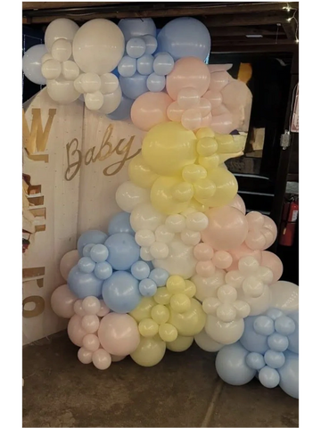 Pastel-colored balloon arrangement for a baby celebration.
