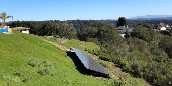 Hillside solar panel installation in a backyard solar motion in California 