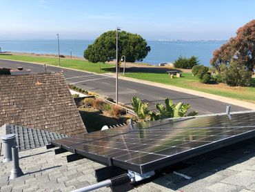 Solar panel on a rooftop with ocean view. Solar installatin done by Solar Motion in Aptos California