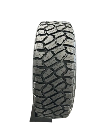 Close-up of a rugged off-road tire tread.