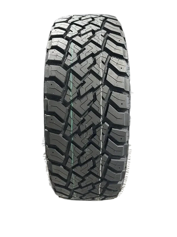 Off-road tire with aggressive tread pattern.
