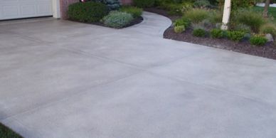 A freshly poured cement driveway, one of our concrete services.