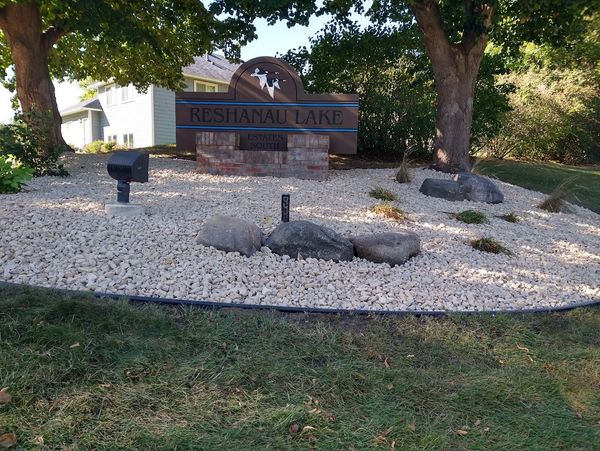 Entrance monument landscape with decorative rock and boulders